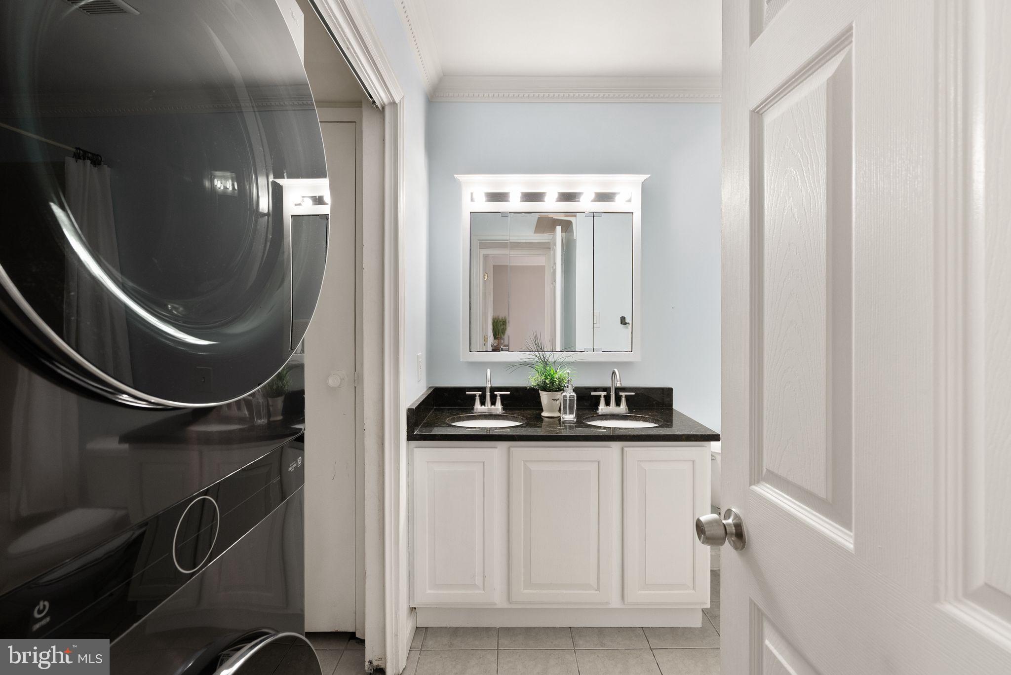 8511 Barrington Court, Unit S Springfield, VA 22152 - Photo 10 of 29 a bathroom with a sink a toilet and mirror