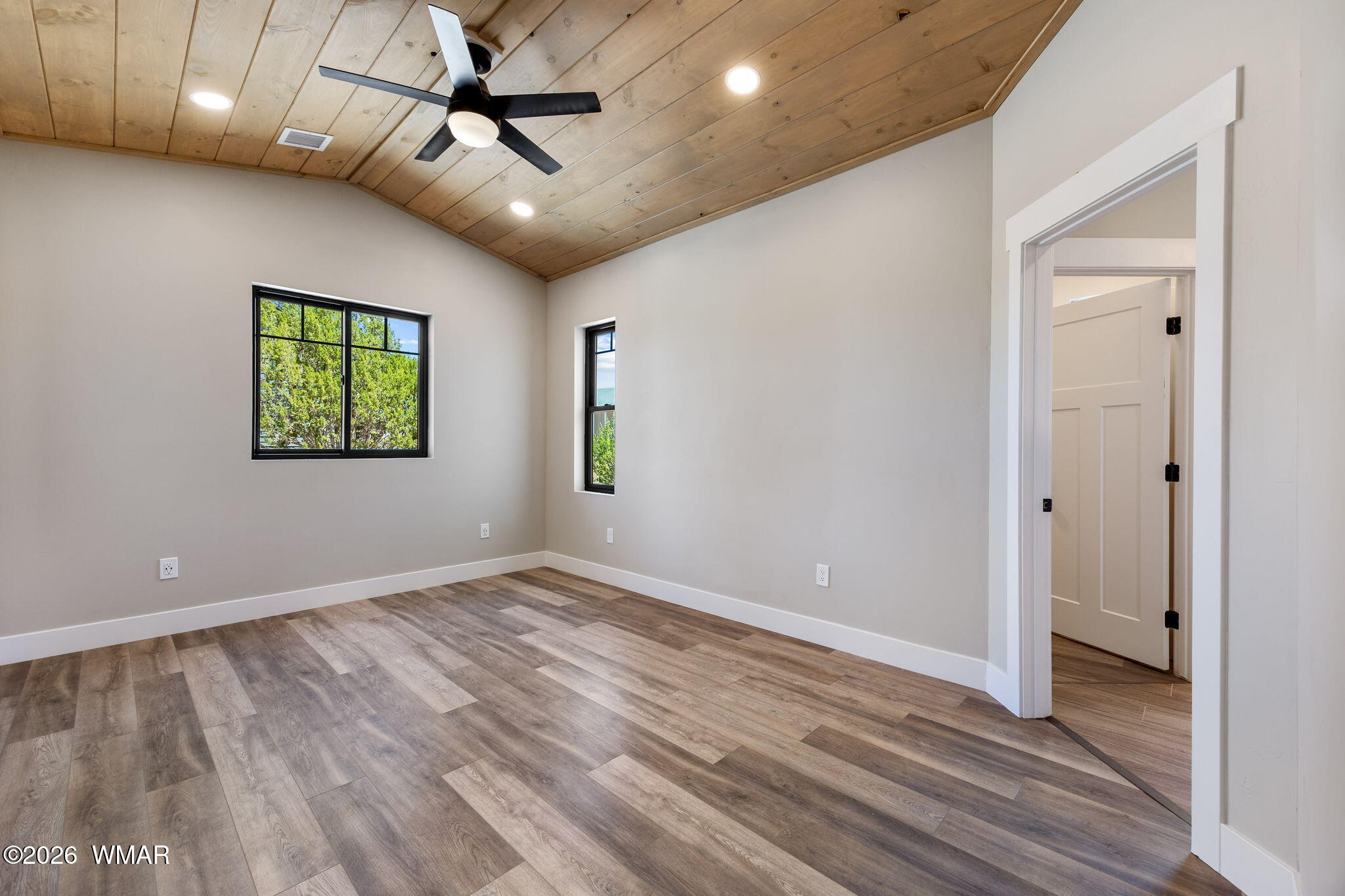 561 South Rock Ridge Drive Show Low, AZ 85901 - Photo 9 of 28 wooden floor in an empty room with a window