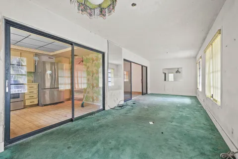 a view of an empty room and window