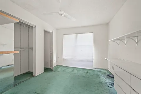 a view of a closet in an empty room