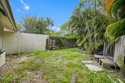 a backyard of a house with lots of green space