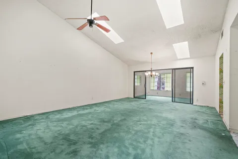 a big room with closet and windows