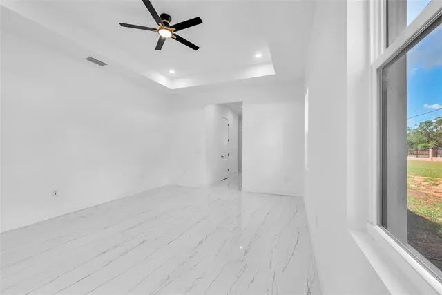 a bathroom with a double vanity sink mirror and shower