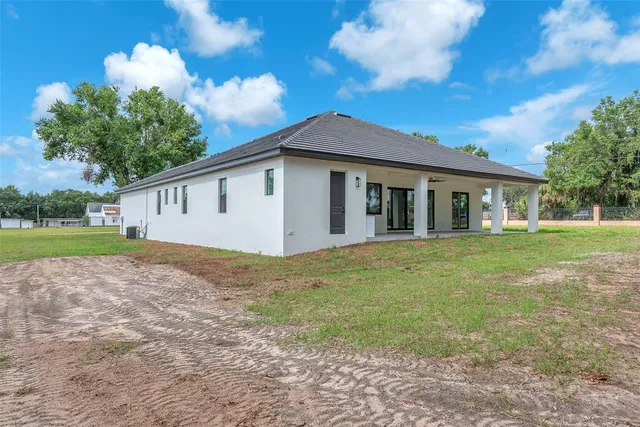 a big yard with large trees and a big yard