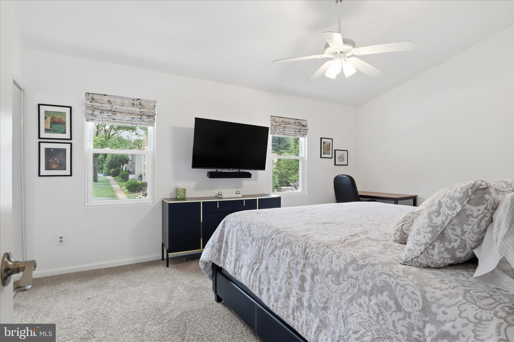 71 Kinsman View Circle Silver Spring, MD 20901 - Photo 16 of 42 a bedroom with a bed and a flat screen tv