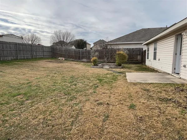 a view of backyard of house