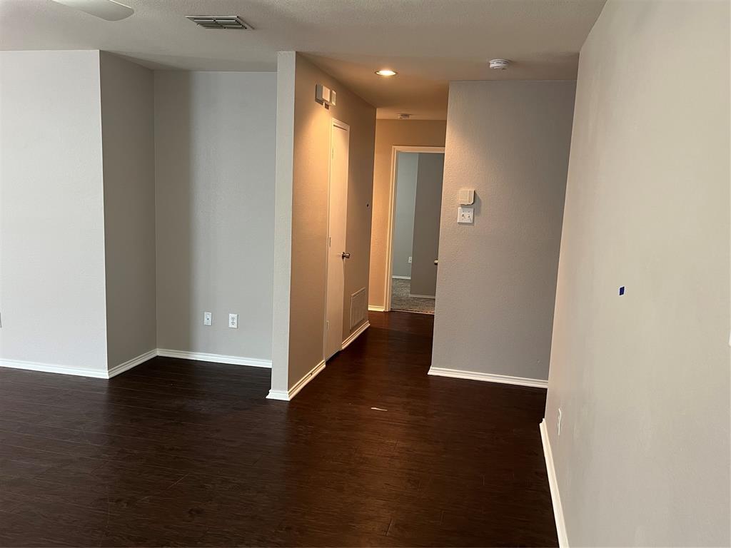 849 Santa Rosa Drive Fort Worth, TX 76052 - Photo 3 of 16 a view of a hallway with wooden floor