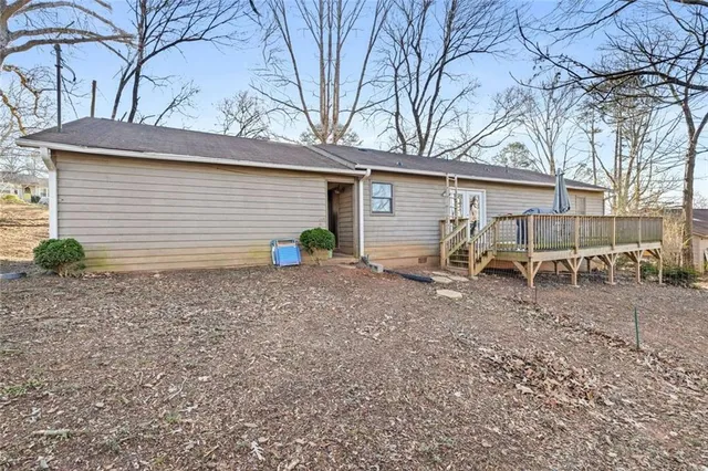 a view of a house with a yard and garage