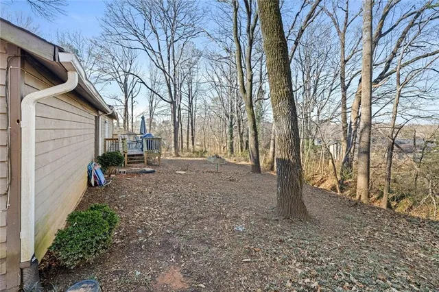a backyard of a house with lots of green space