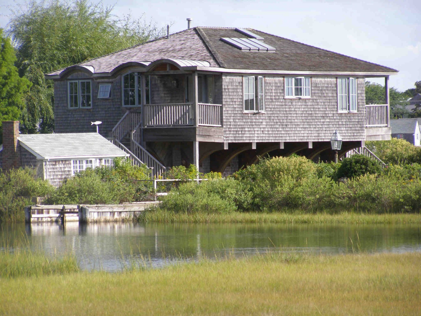 17 Dunham Road Edgartown, MA 02539 - Photo 2 of 2 a front view of a house with a yard