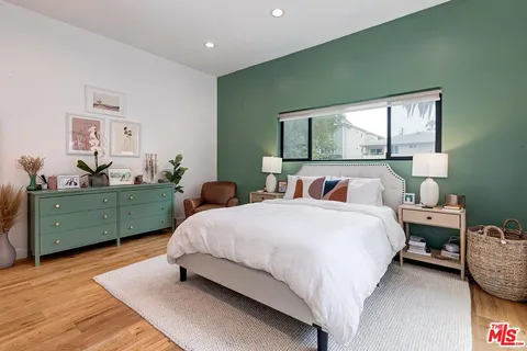 a bedroom with a bed and window