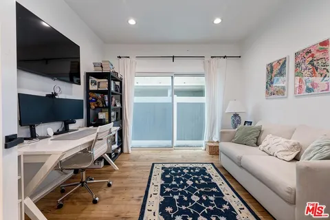 a balcony with table and chairs