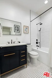 a view of a hallway with washer and dryer
