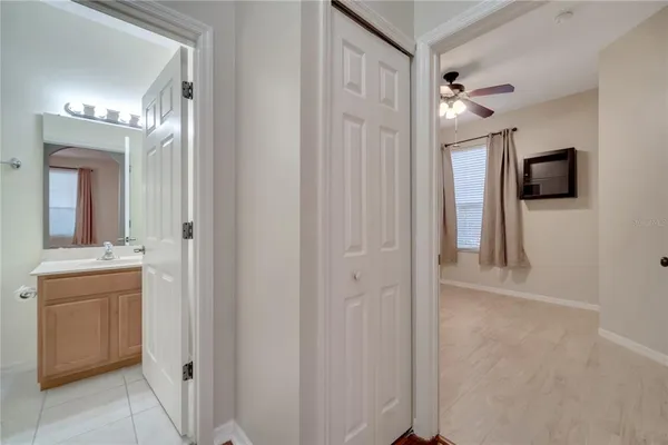 a view of a hallway with bathroom