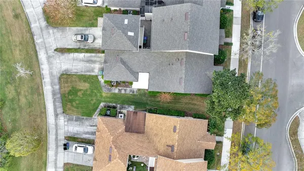 aerial view of a house with a garden and plants