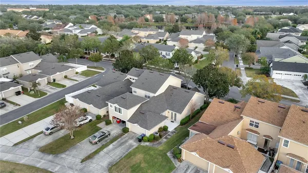 an aerial view of a residential houses with outdoor space
