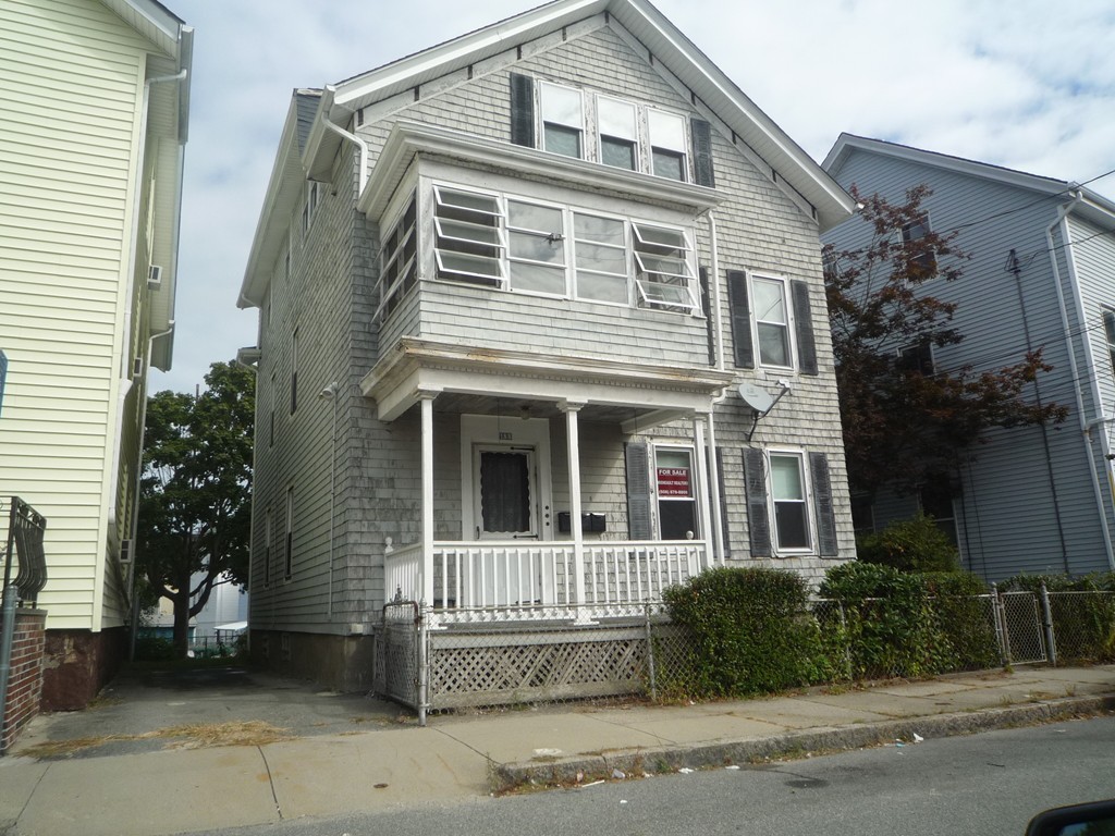 188 Cottage Street Fall River, MA 02721 - Photo 1 of 24 a front view of a house with a garden