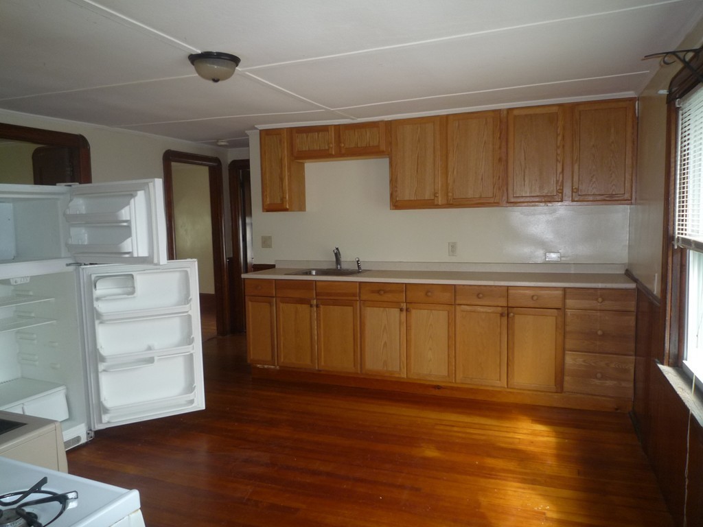 188 Cottage Street Fall River, MA 02721 - Photo 18 of 24 a kitchen with a sink and cabinets