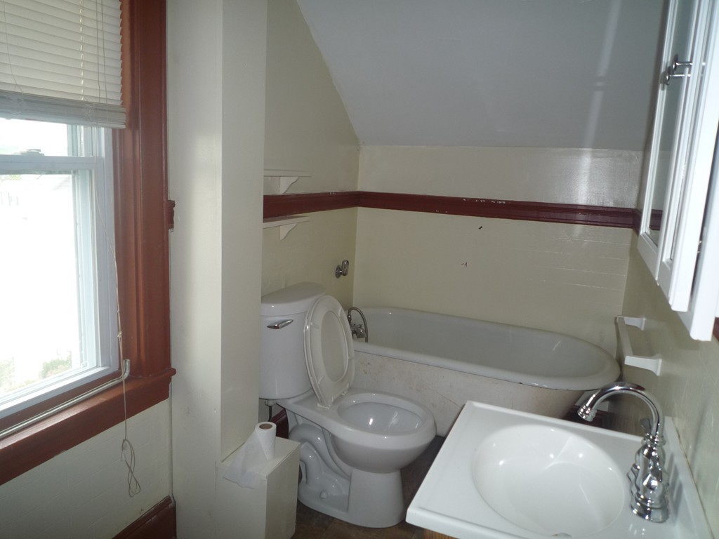 188 Cottage Street Fall River, MA 02721 - Photo 21 of 24 a bathroom with a toilet sink and mirror