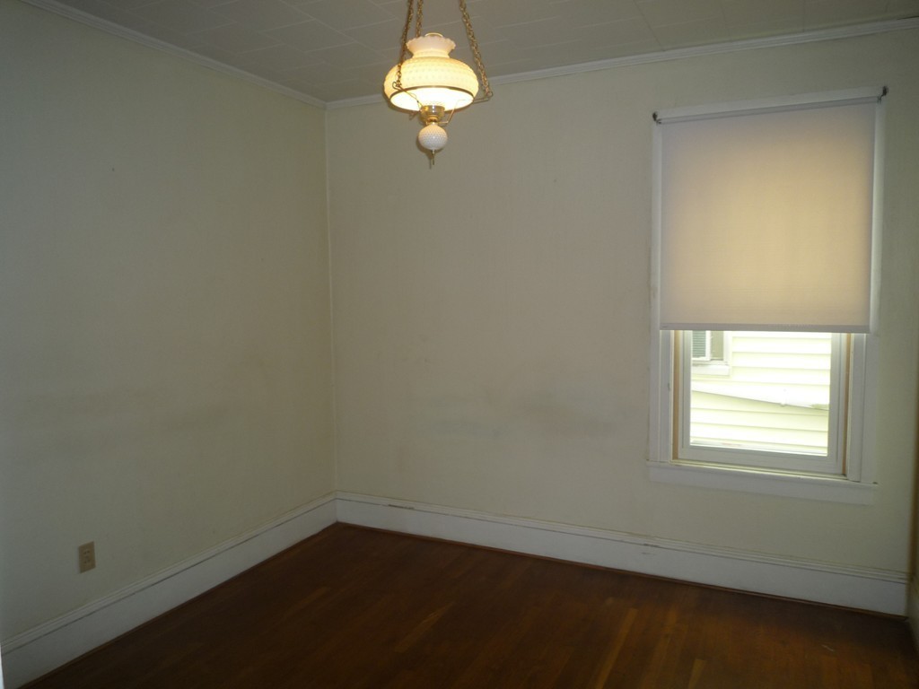 188 Cottage Street Fall River, MA 02721 - Photo 6 of 24 an empty room with a window