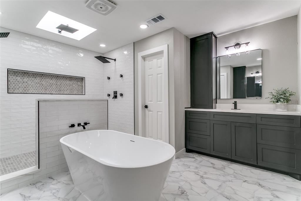 3913 Bobbin Lane Addison, TX 75001 - Photo 16 of 23 Full bathroom with walk in shower, vanity, a soaking tub, and recessed lighting