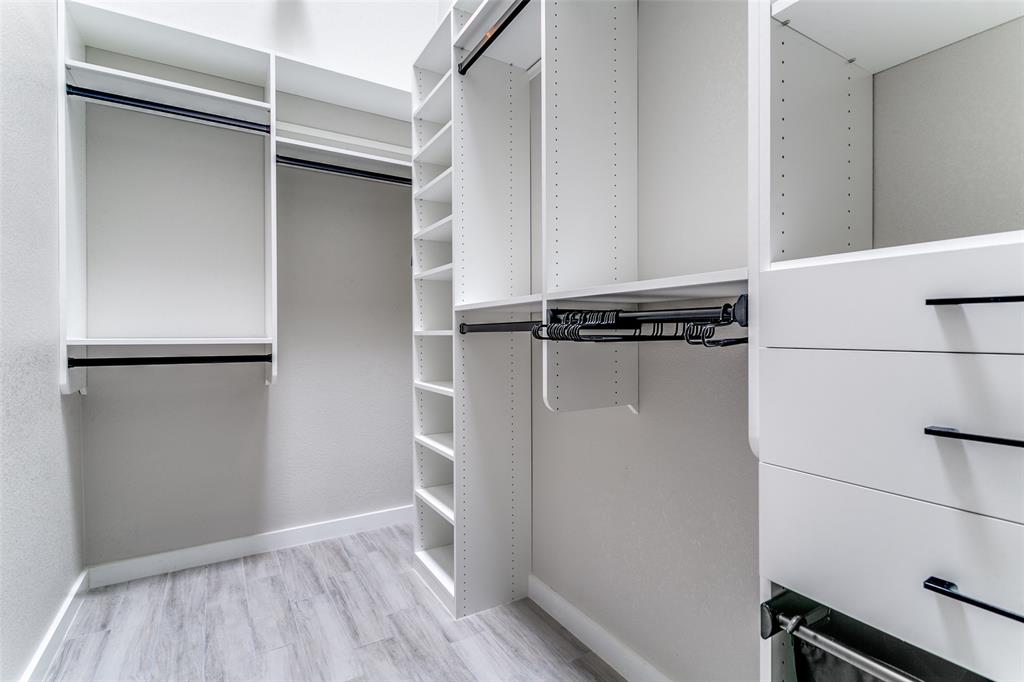 3913 Bobbin Lane Addison, TX 75001 - Photo 18 of 23 Walk in closet featuring light wood finished floors