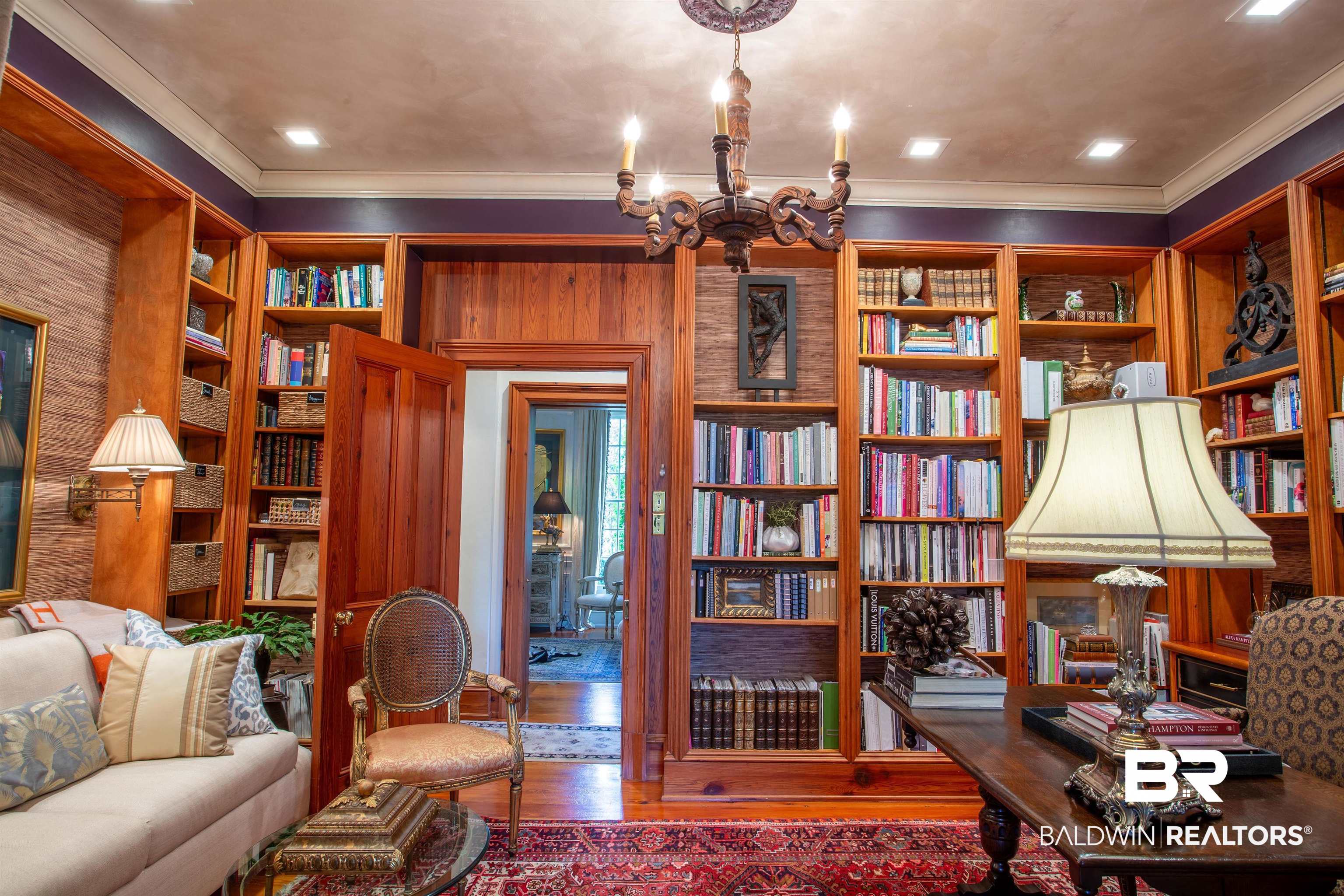 150 Austill Avenue Mobile, AL 36608 - Photo 16 of 39 Built-in wooden bookshelves framing doorways, complete with recessed lighting and crown molding