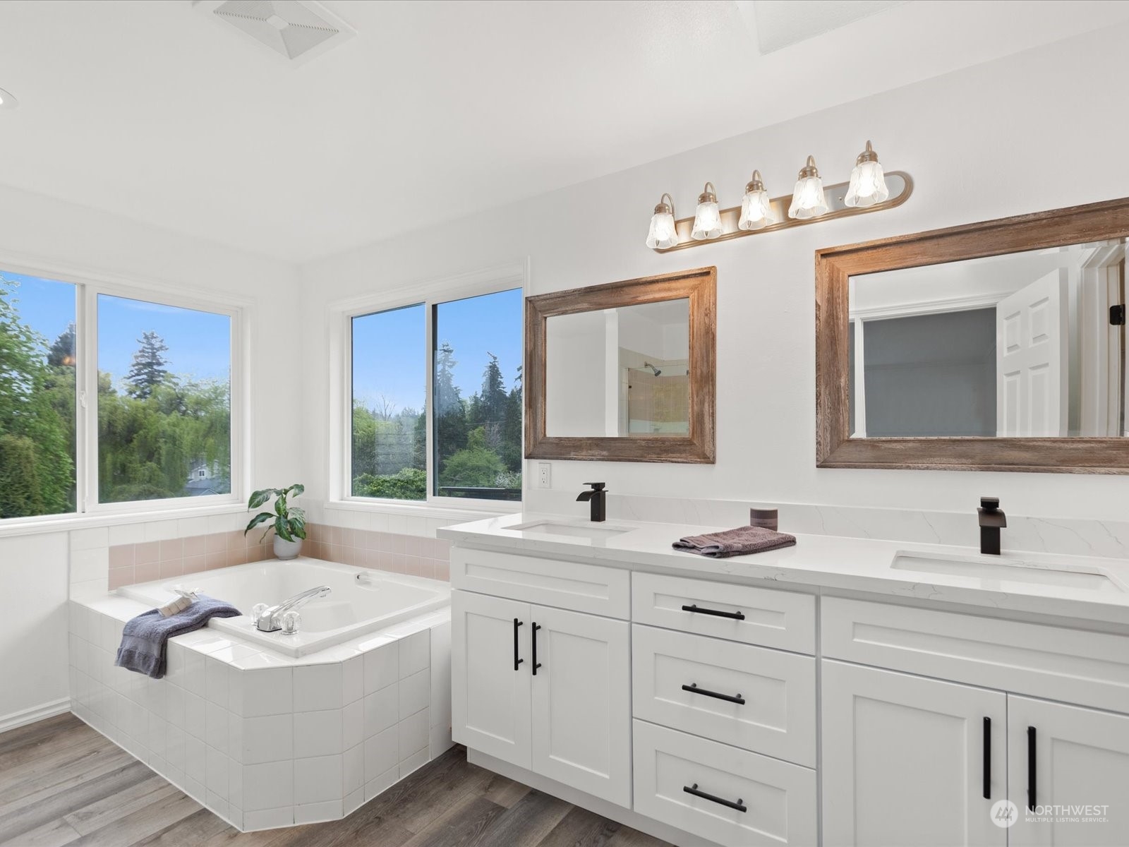 22626 8th Drive Southeast Bothell, WA 98021 - Photo 17 of 39 a bathroom with a granite countertop sink mirror and bathtub