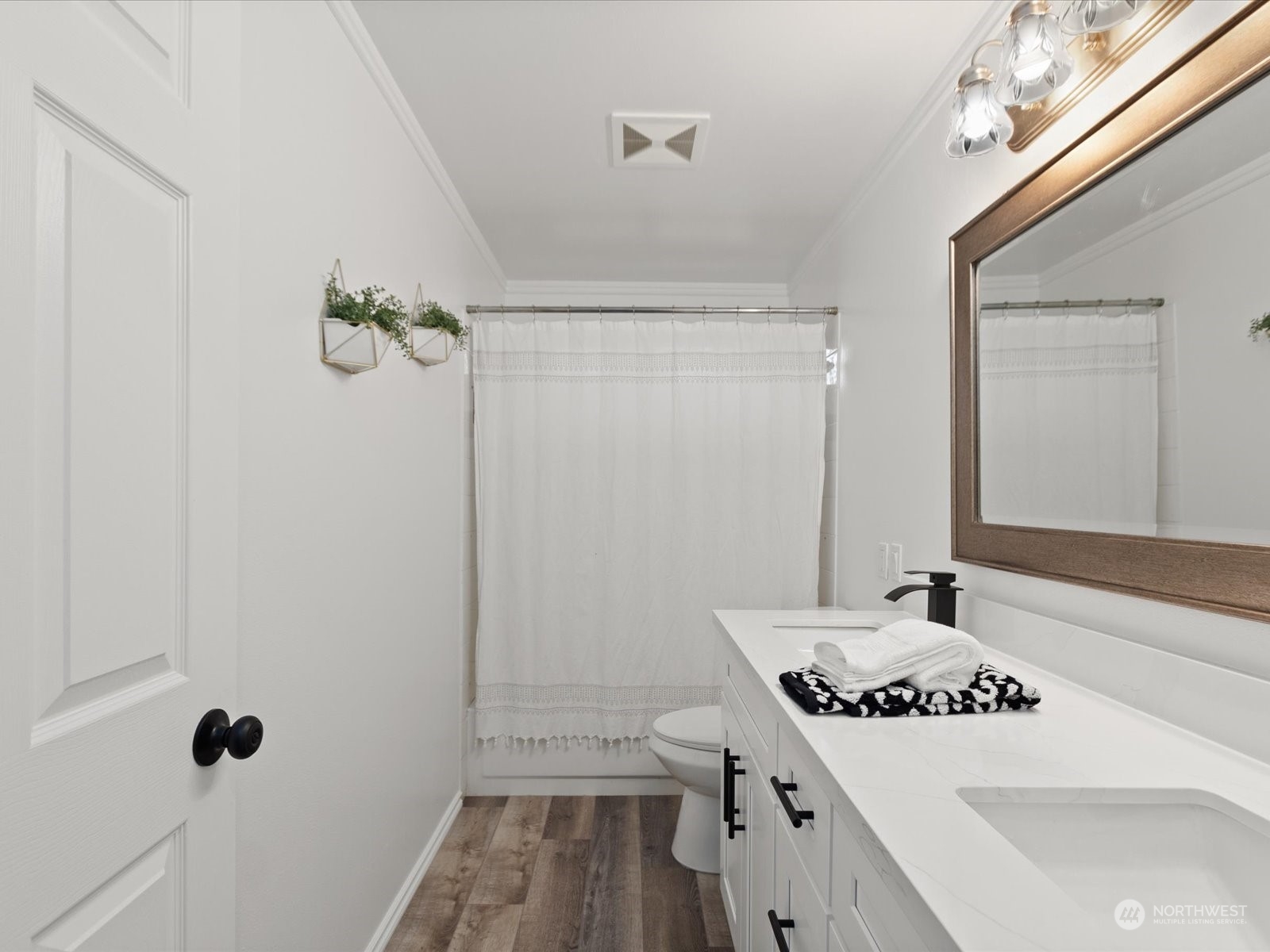 22626 8th Drive Southeast Bothell, WA 98021 - Photo 23 of 39 a bathroom with a sink a toilet a mirror and shower