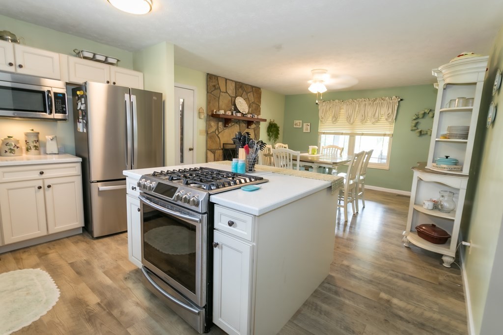 3108 Fortenberry Road Kodak, TN 37764 - Photo 21 of 47 a kitchen with a sink stove and refrigerator