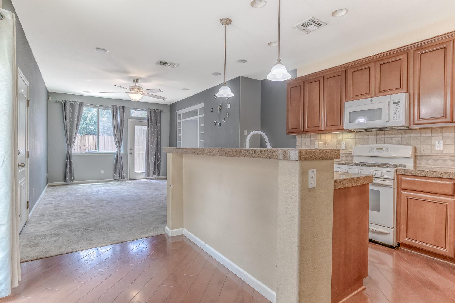 188 Thomsen Road Lathrop, CA 95330 - Photo 10 of 27 a kitchen with kitchen island a sink stainless steel appliances and cabinets