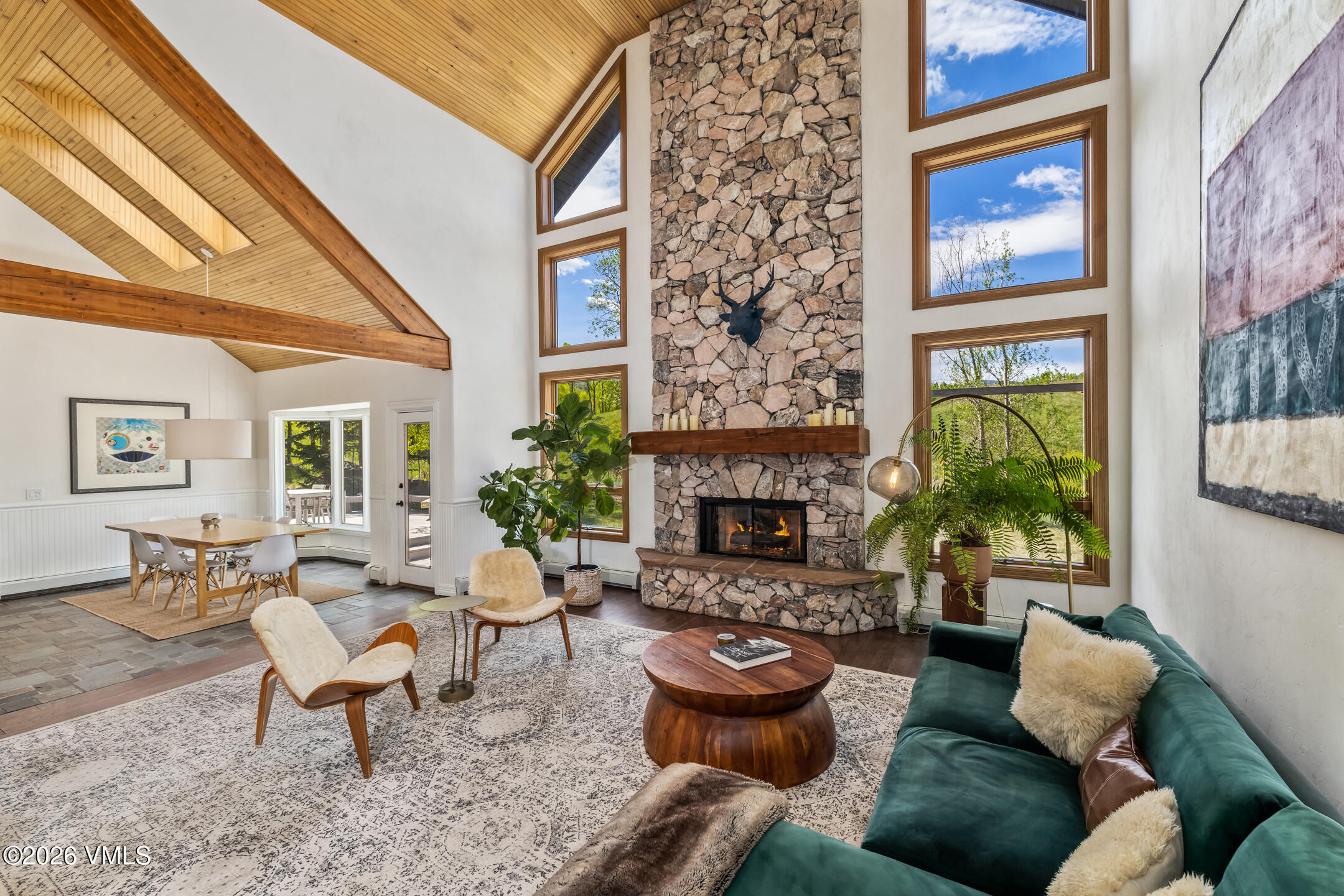 321 Meile Lane Edwards, CO 81632 - Photo 3 of 44 a living room with furniture a fireplace and a floor to ceiling window