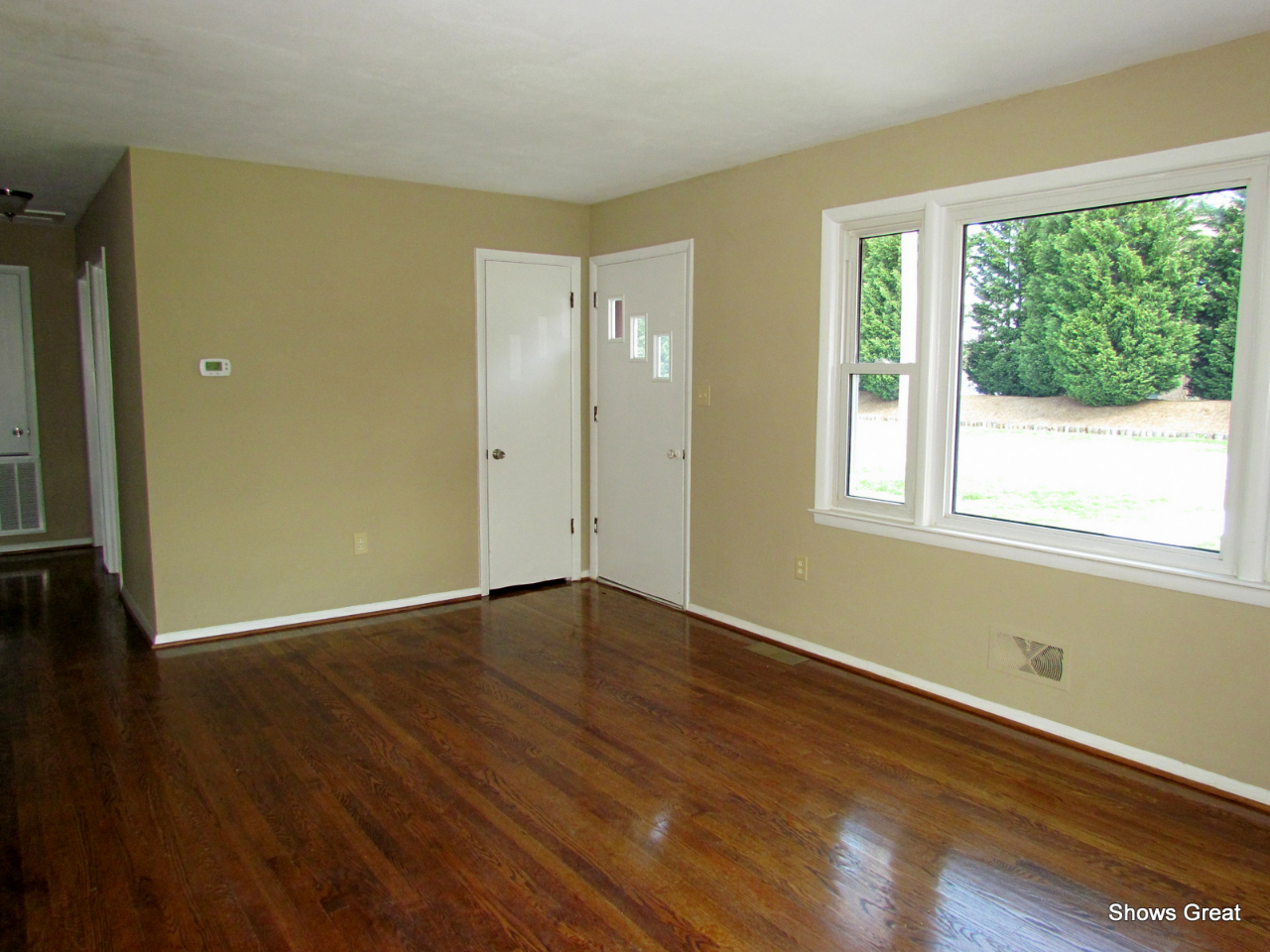 4944 Florist Road Roanoke, VA 24012 - Photo 5 of 20 a view of an empty room with wooden floor and a window