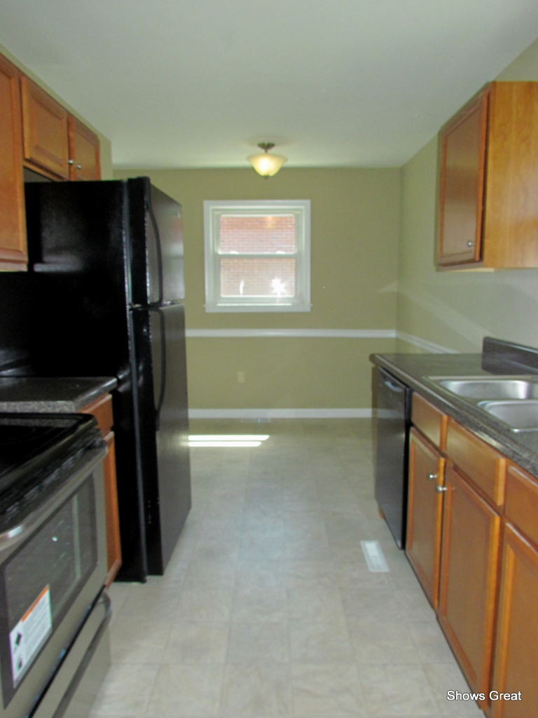 4944 Florist Road Roanoke, VA 24012 - Photo 7 of 20 a kitchen with a refrigerator and a sink