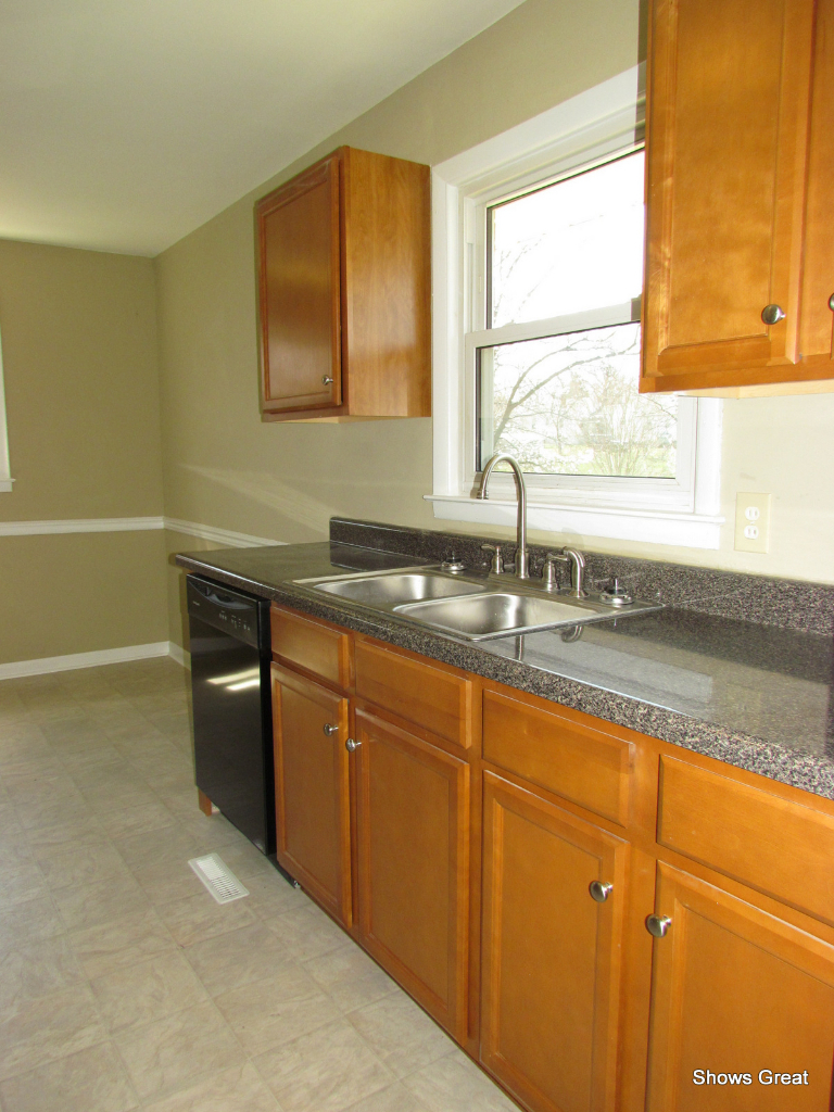 4944 Florist Road Roanoke, VA 24012 - Photo 9 of 20 a kitchen with granite countertop a sink and a window