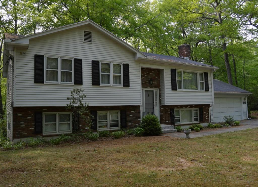 1840 Shepard Avenue Hamden, CT 06518 - Photo 1 of 1 a front view of a house with garage