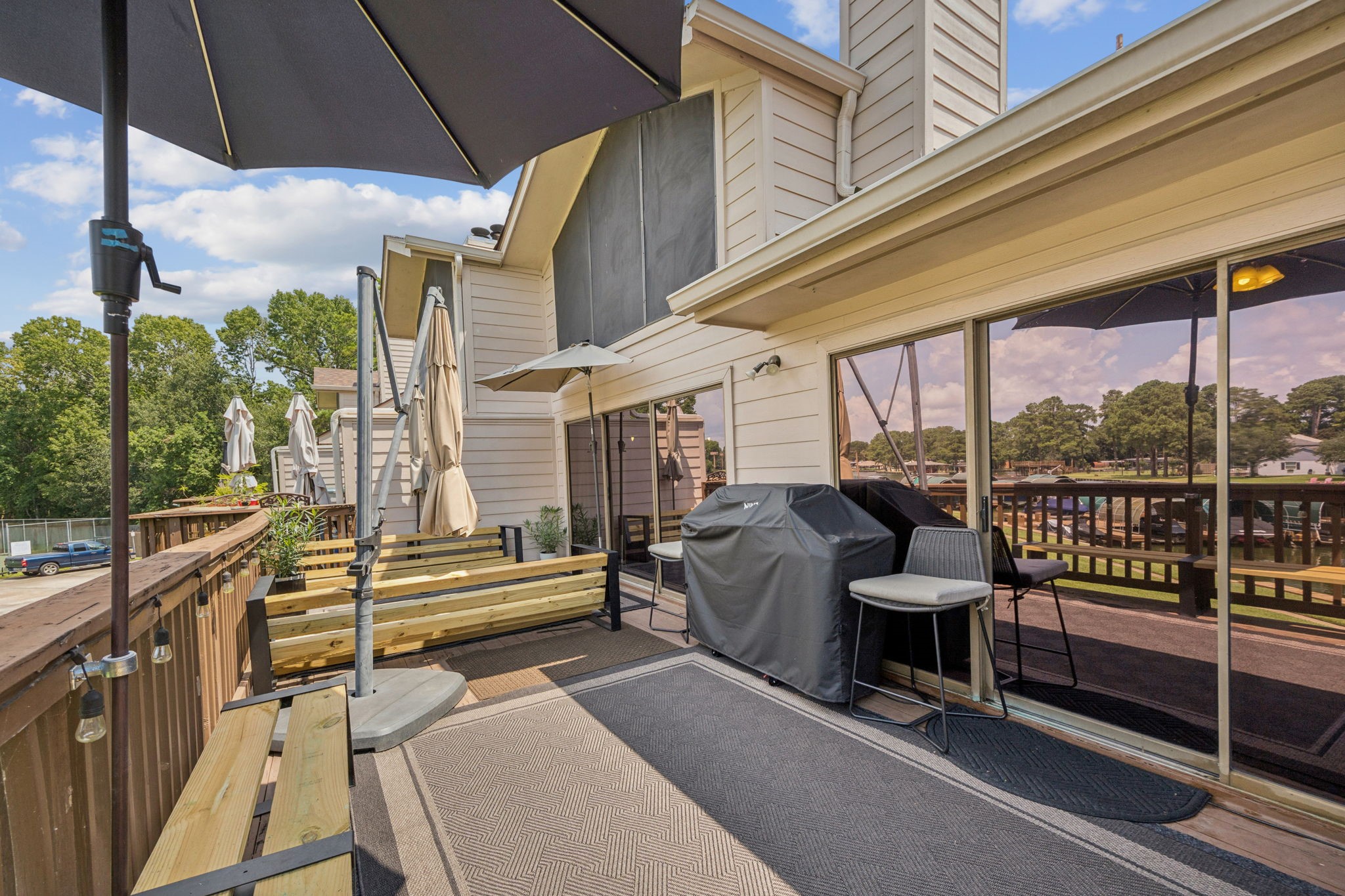 500 River Road, Unit 106 Montgomery, TX 77356 - Photo 5 of 32 This spacious deck offers enough room for shaded lounging and dining, and direct access to beautiful waterfront views, perfect for entertaining or relaxing outdoors.