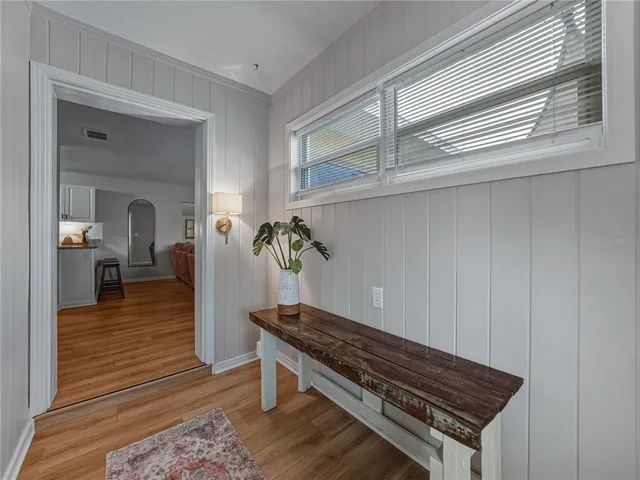 a spacious bathroom with a granite countertop sink and a mirror