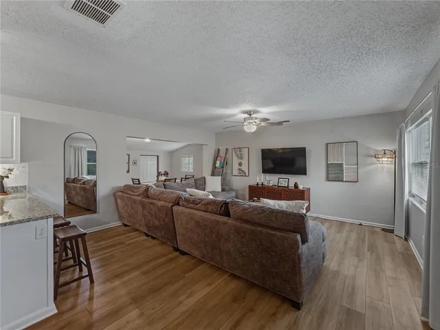 a view of a dining room with furniture and window