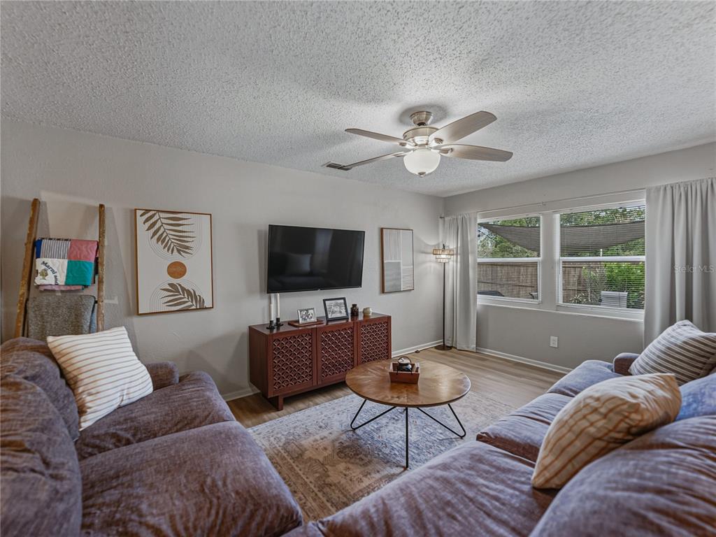 228 Azalea Street Lakeland, FL 33803 - Photo 18 of 80 a living room with furniture and a flat screen tv