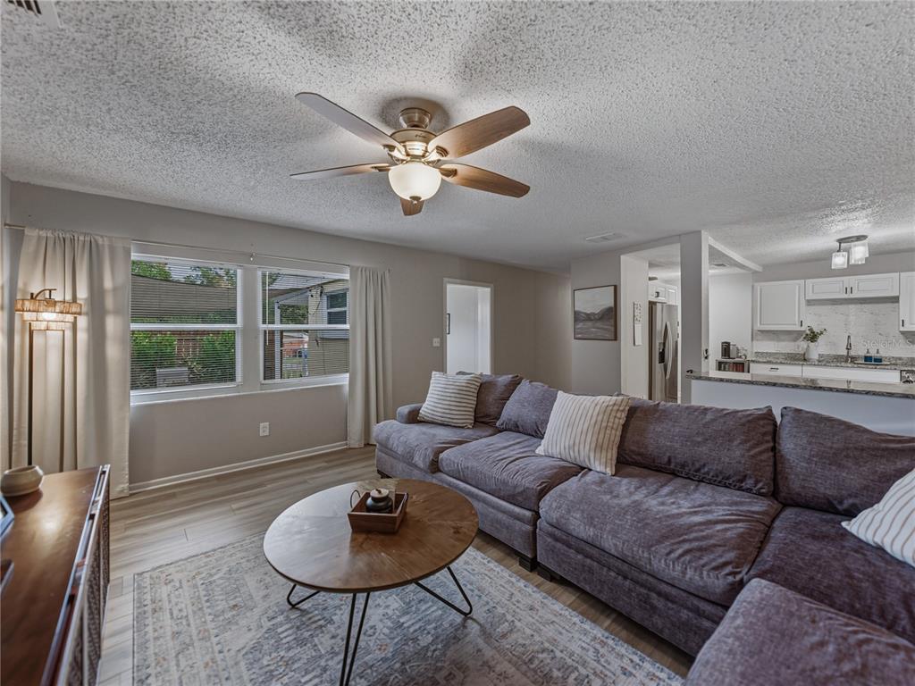 228 Azalea Street Lakeland, FL 33803 - Photo 19 of 80 a living room with furniture and a large window