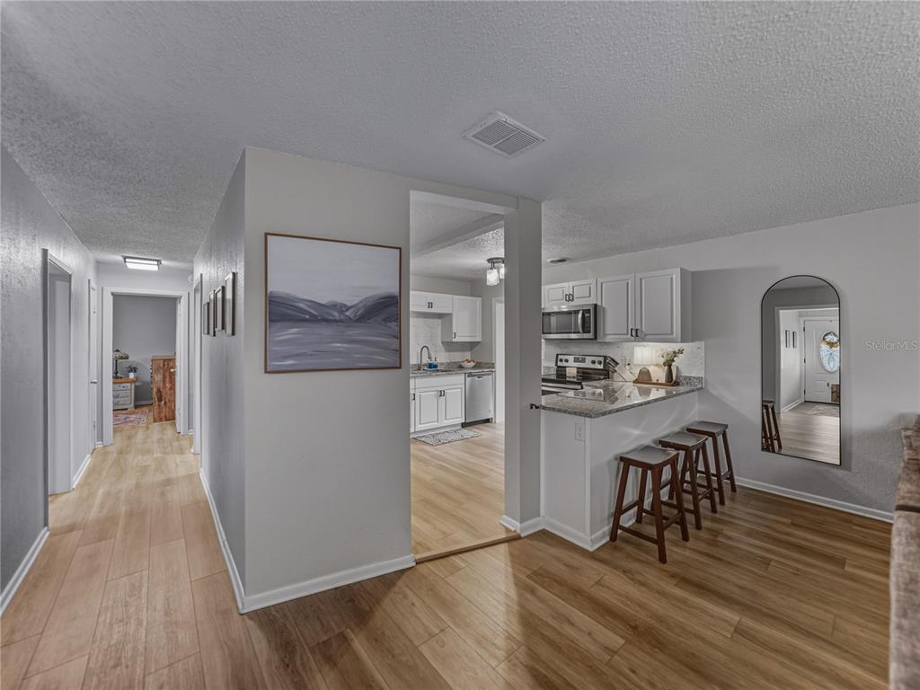 228 Azalea Street Lakeland, FL 33803 - Photo 20 of 80 a view of a kitchen from the dinning room