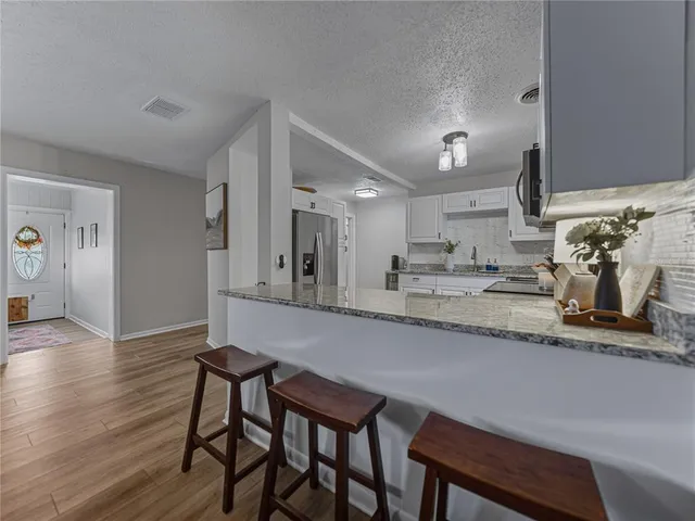 a bedroom with a bed and a tv