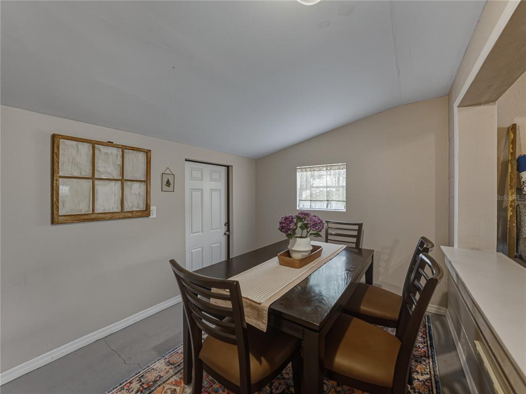 228 Azalea Street Lakeland, FL 33803 - Photo 27 of 80 a view of a dining room with furniture and window