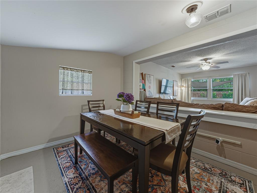 228 Azalea Street Lakeland, FL 33803 - Photo 28 of 80 a view of a dining room with furniture and window