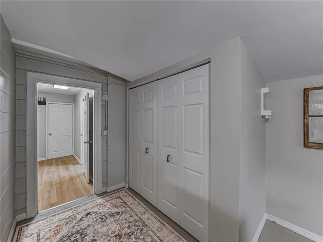 a bedroom with furniture and a chandelier