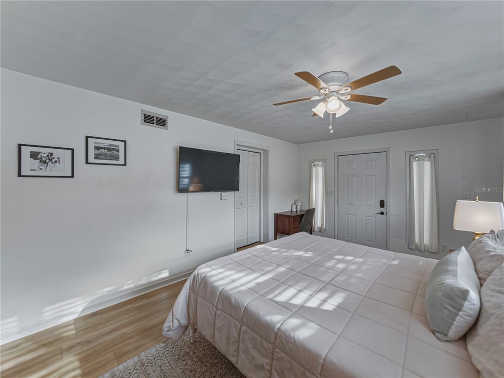 228 Azalea Street Lakeland, FL 33803 - Photo 34 of 80 a bedroom with a bed and a flat screen tv