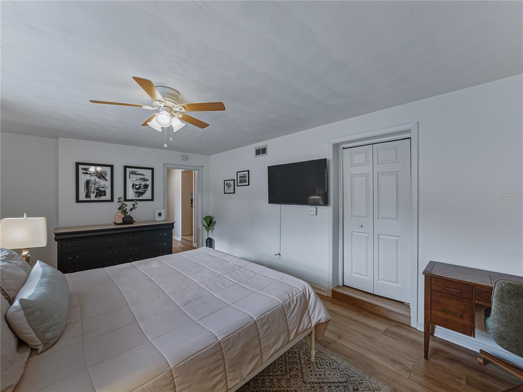 228 Azalea Street Lakeland, FL 33803 - Photo 35 of 80 a bedroom with a bed and a tv