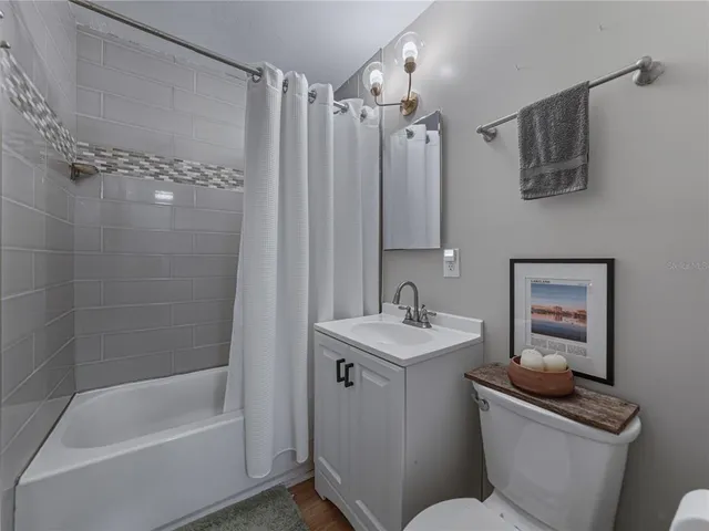 an aerial view of a house with outdoor space