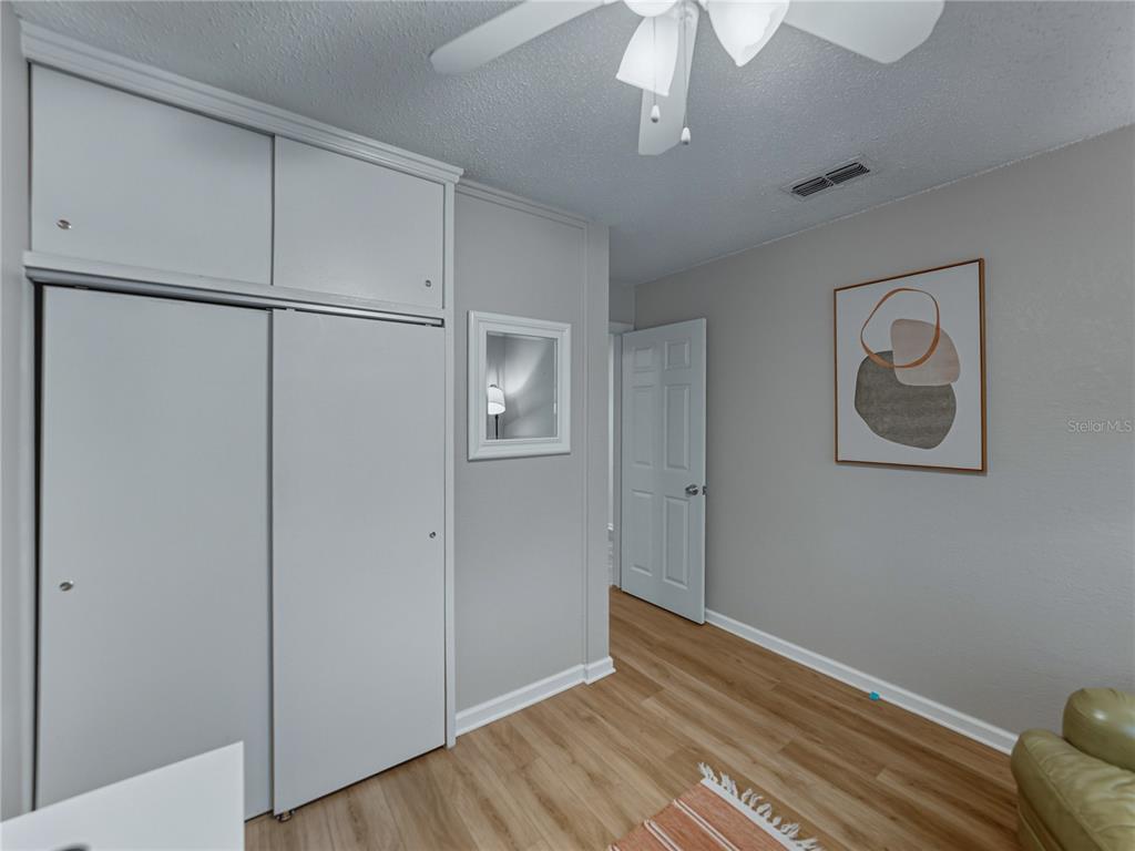 228 Azalea Street Lakeland, FL 33803 - Photo 48 of 80 a view of empty room with wooden floor